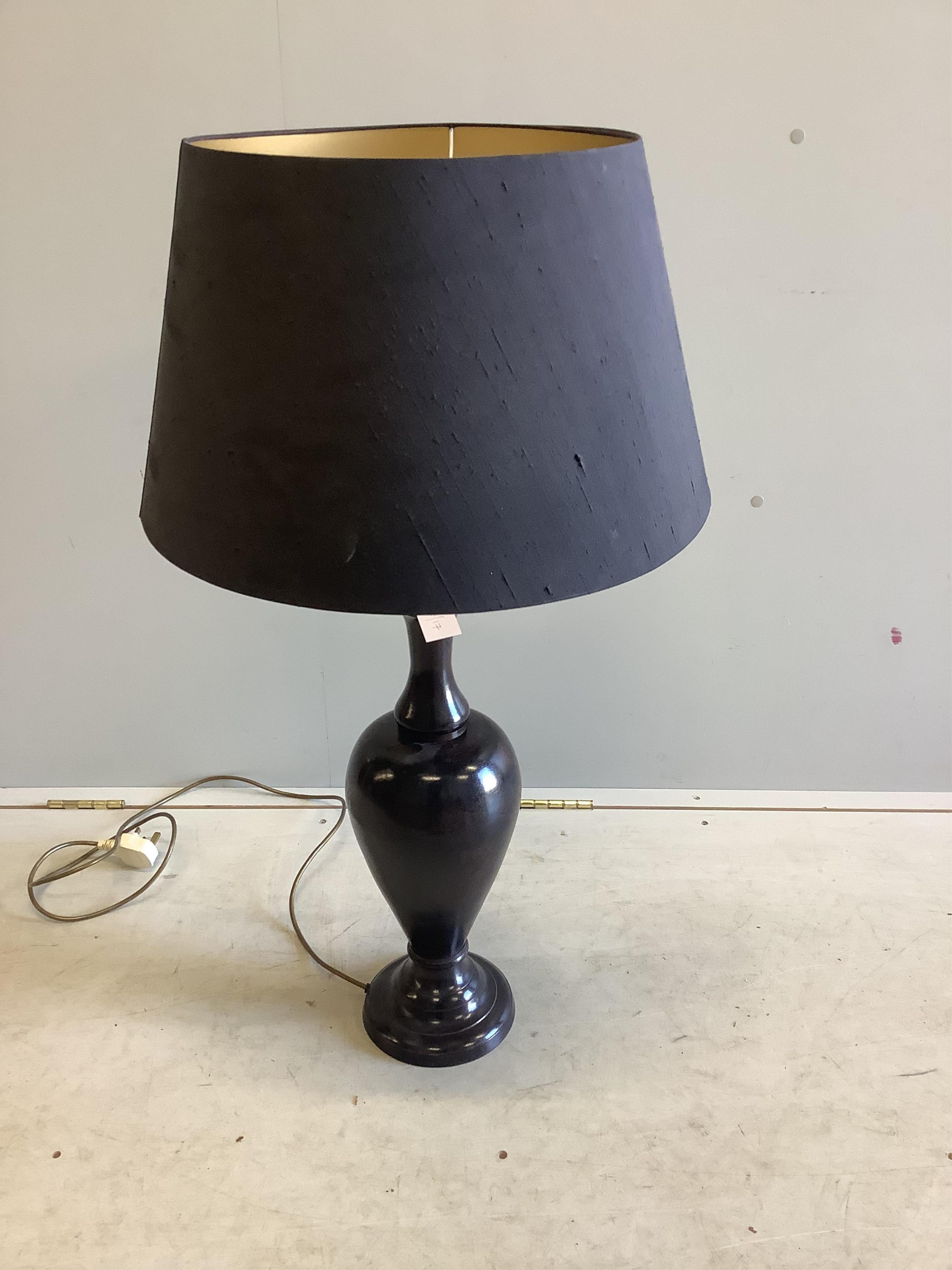 A Contemporary faux bronze table lamp, height including shade 89cm. Condition - good